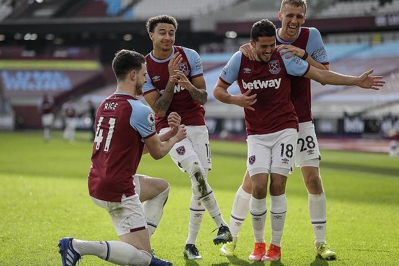 Jesse Lingard (second from left), on loan from Manchester United, celebrating with West Ham teammates after doubling their lead against Spurs.