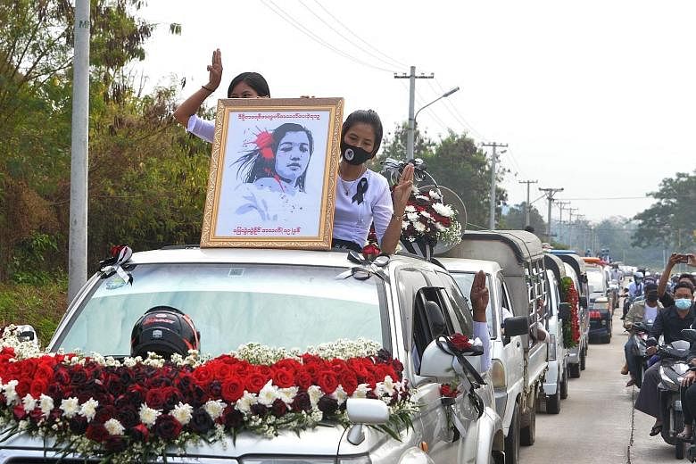 A portrait of young protester Mya Thwate Thwate Khaing placed at the head of a convoy for her funeral in Naypyitaw yesterday. The 20-year-old died on Friday after being shot during a rally against the Feb 1 military coup. The military media said the 