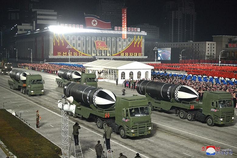 Left: A military parade in Pyongyang on Jan 14 to celebrate the 8th Congress of the Workers' Party of Korea, with what appeared to be submarine-launched ballistic missiles on display. After three high-profile summits with the US, North Korea is actua