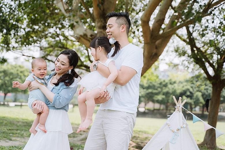Ms Yen Tzu-hsin, 30, with her husband Jerry Kao, 31, and their children - five-year-old Emma and two-year-old Eddie. Ms Yen said support from her and her husband's parents helps them cope with the high costs of raising children, adding: "If not for f