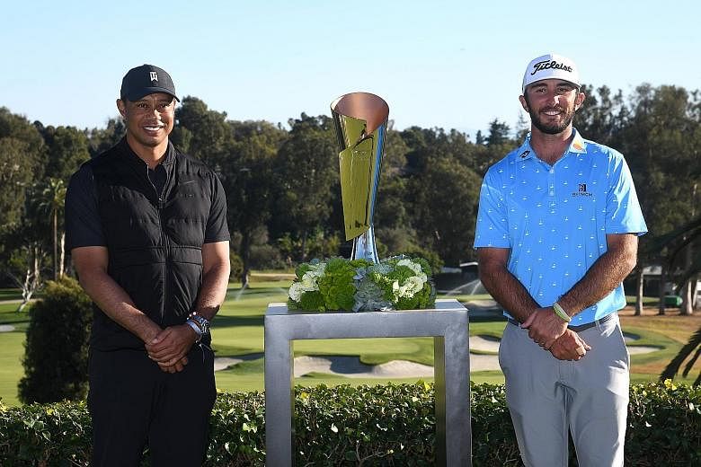 Genesis Invitational host Tiger Woods and winner Max Homa (right) posing with the trophy after the latter beat Tony Finau in the play-off at the Riviera Country Club in California. PHOTO: AGENCE FRANCE-PRESSE
