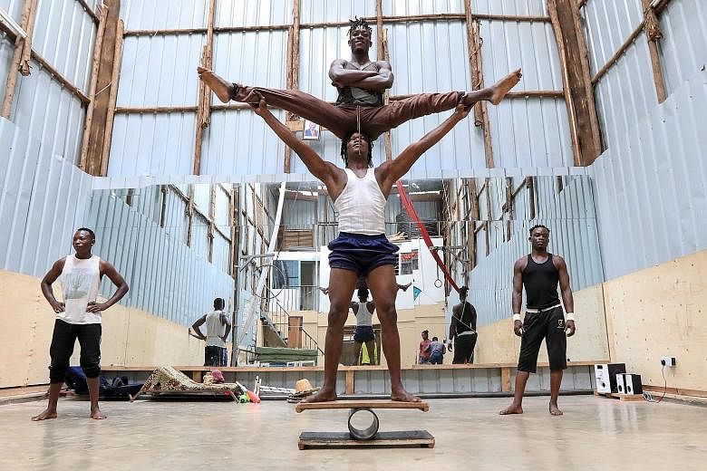 UPLIFTING SPIRITS:(Above, far left and left) Kenyan acrobatic members of the Mighty Jambo Circus Academy during their training routine at the school in Nairobi, Kenya. The academy has resumed its daily exercise regimen after months of closure since t