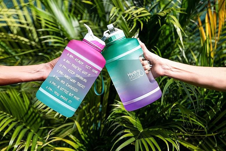 Motivational water bottles, such as these from HydroMate (left), come with markings and phrases that aim to get people to drink water.