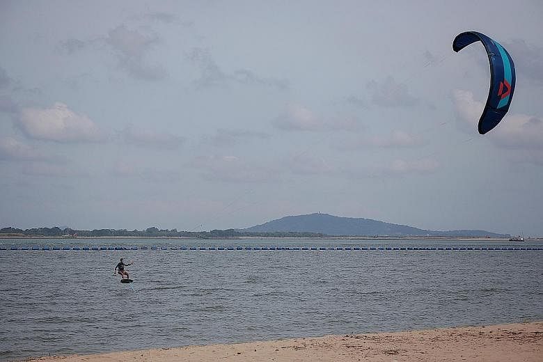 A person kite-surfing at Changi Beach last month. The long-term average monthly surface wind speed recorded at the Changi climate station was about 3 metres per second last month and this month. In other months of the year, the average wind speed doe