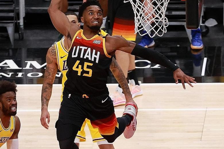 Donovan Mitchell soaring to a dunk against the Lakers, after confirming his spot as a reserve for the All-Star game. The Jazz, who hold the best regular-season record, handed the champions their biggest loss this season.