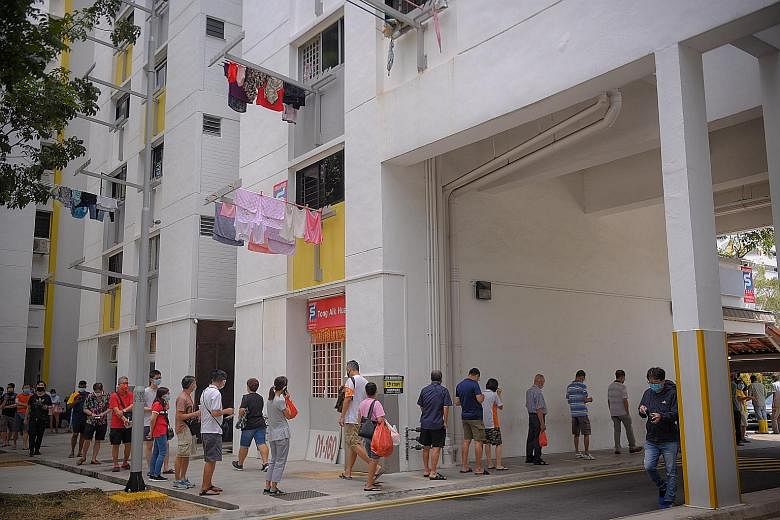 Punters hoping to win the jackpot prize in this year's Toto Hongbao draw queueing at a Singapore Pools outlet in Hougang Street 61 yesterday at lunchtime. Queues were seen at outlets that The Straits Times visited in Yishun, Ang Mo Kio and Bishan as 