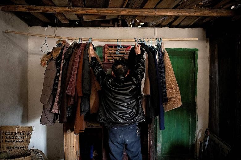 Farmer Liu Qingyou at his residence in Baojing county, Hunan province, last month. "The economic gap between rural and urban Chinese is still very substantial," says an expert.