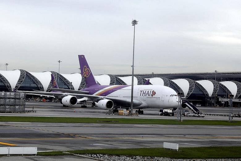 Thai Airways said in an exchange filing yesterday that its net loss widened to 141.2 billion baht (S$6.19 billion) from 12 billion baht in 2019. PHOTO: REUTERS