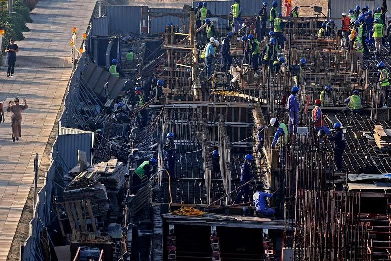 Construction workers at a building site in Dubai Creek last month. Remittances to the Philippines fell 0.8 per cent last year. Officials expect remittances to grow 4 per cent this year but a Manila-based recruitment consultant believed the rate would