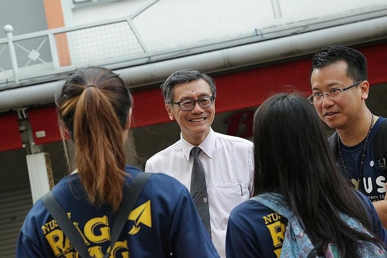 (Top) The Faculty of Arts and Social Sciences and the Faculty of Science at the National University of Singapore. (Above) NUS president Tan Eng Chye mingling with students before the Covid-19 pandemic.