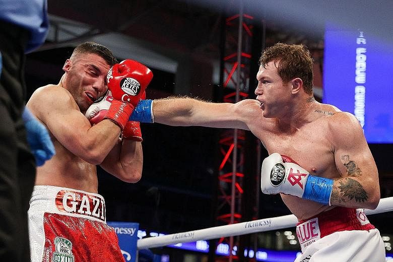 Saul Alvarez punching Avni Yildirim during their bout in Florida. The Mexican will next fight Briton Billy Joe Saunders in May.