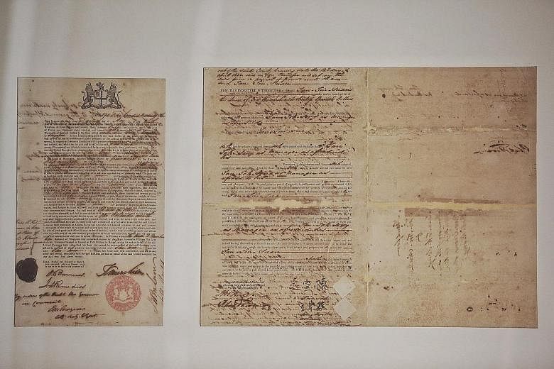 A set of two original land sales records - one of which bears the original signature of Tan Tock Seng, one of SHHK's founding leaders. These were presented to Mr Ng to symbolise the handover of the documents to the National Library Board. Deputy Prim