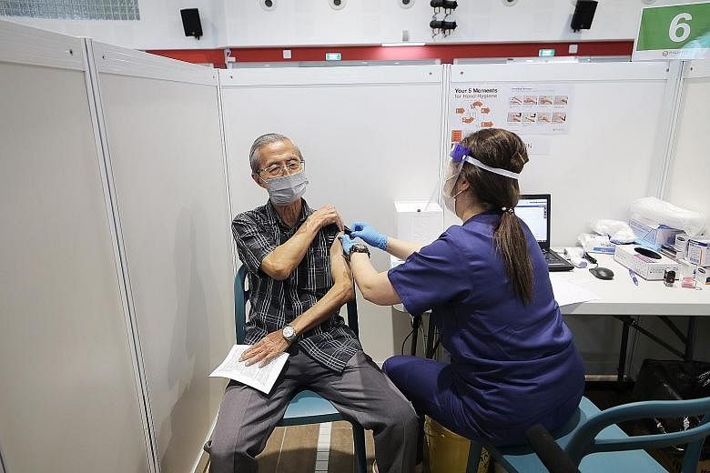 The Covid-19 vaccine being administered at the vaccination centre in Jalan Besar Community Club last month. Besides Covid-19 test results, Singapore will look into extending HealthCerts to capture vaccination records. Medical technologists at Innovat