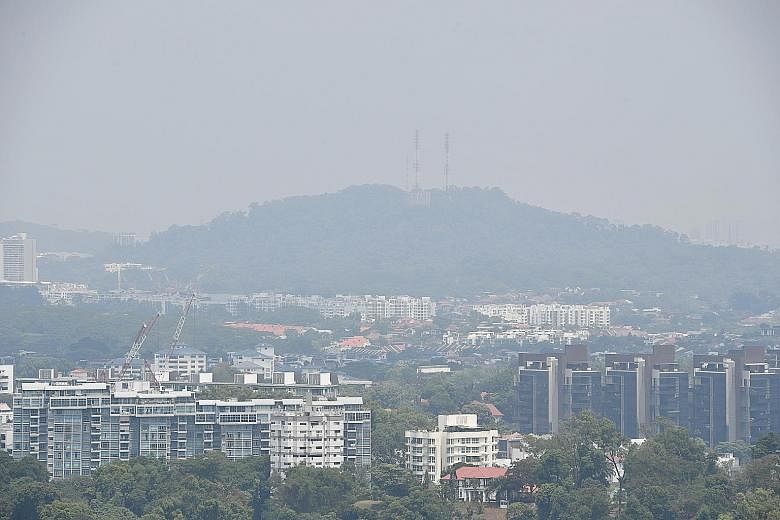 Hazy air over Singapore, as seen from the Queenstown area yesterday. Air quality in the Republic hit unhealthy levels at the weekend, and the likely cause was elevated levels of ozone, which can form when components of the air react under specific en