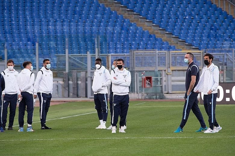 Lazio players waiting in vain for 45 minutes for Torino to arrive at the Olympic Stadium in Rome on Tuesday. Coronavirus-hit Torino, serving a quarantine, have vowed to appeal against the league's decision to forfeit the Serie A match and award Lazio