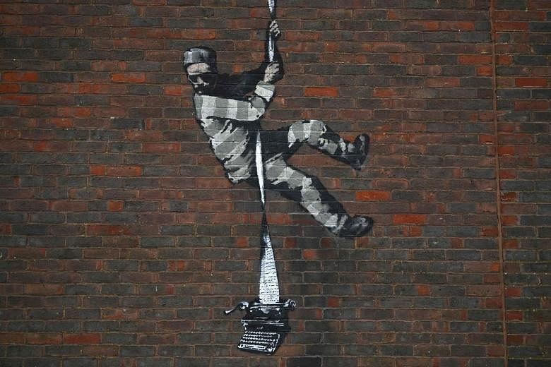 Banksy at work: Black hoodie, head torch, paint and freedom | The