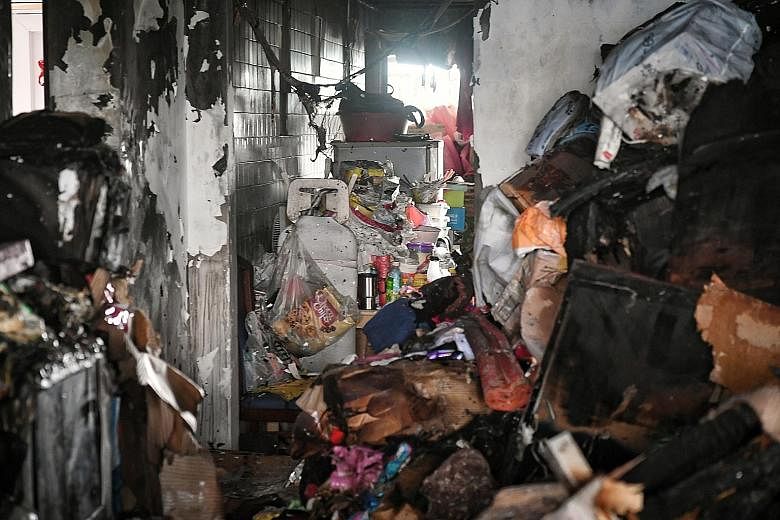 The Singapore Civil Defence Force said the "heaps of items" inside the three-room flat made it difficult for firefighters to move around. When ST went to the flat, there was a clutter of items in the living room. In one of the bedrooms, there were pi