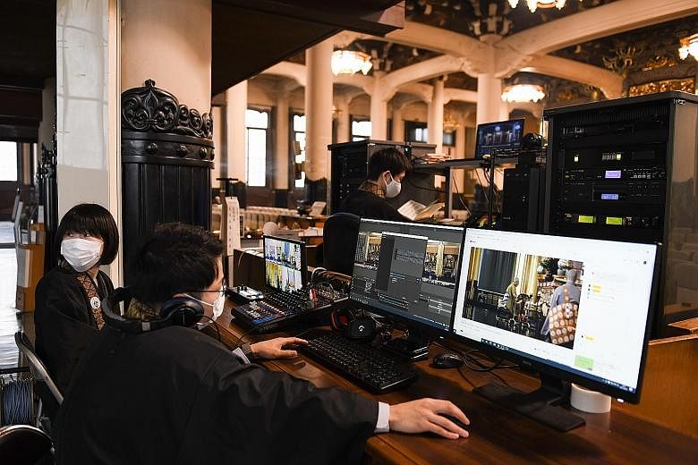 Tsukiji Hongwanji temple staff doing a live online broadcast of a memorial service in Tokyo last month. The four-century-old Japanese temple started online memorial services last May. PHOTO: BLOOMBERG