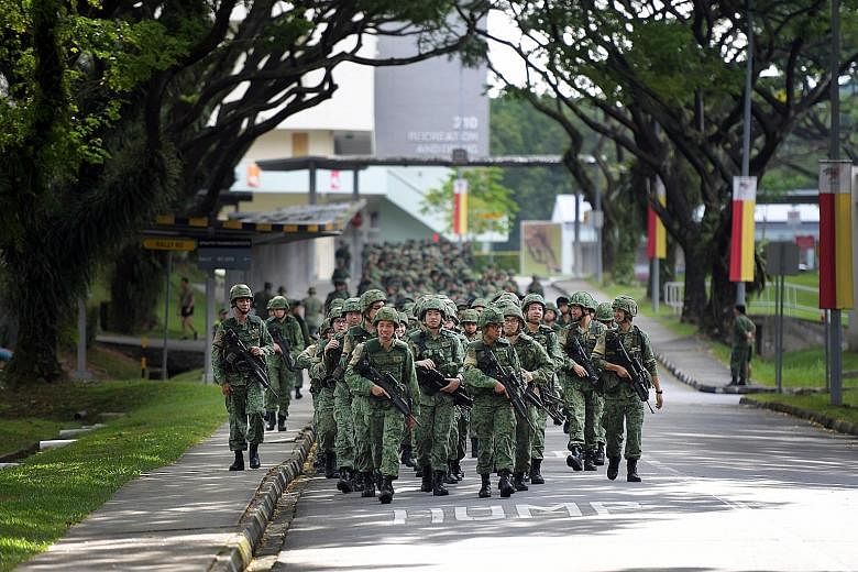 Combat-fit soldiers going on a route march. A review of the Singapore Armed Forces' medical screening and classification systems, coupled with the redesigning of roles and outsourcing of tasks, will allow servicemen to possibly take on front-line, op