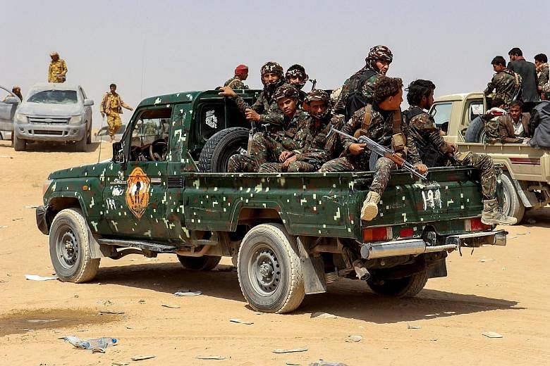 Soldiers in a patrol truck on Feb 28 in Marib, the Yemeni government's last northern stronghold, where fighting has intensified. PHOTO: REUTERS