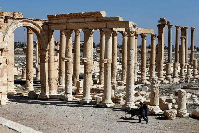 The ruins of Syria's ancient city of Palmyra. Its destruction by ISIS was just one of the irretrievable losses inflicted on Syria's heritage during a war that did not spare a single of the country's regions. PHOTO: AGENCE FRANCE-PRESSE