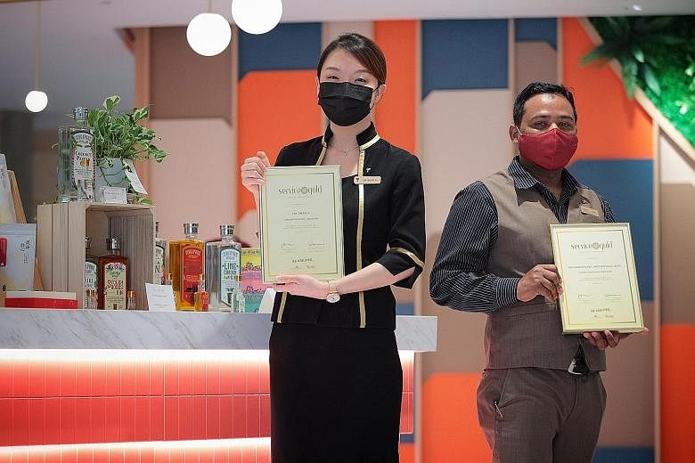 Ms Lim Cheah Yi, a guest services officer at Furama RiverFront, and Mr Mohammad Nurul Amin Mohsinul Azam, a junior supervisor at Conrad Centennial Singapore, received the National Kindness Award - Service Gold at a ceremony at Furama RiverFront yeste