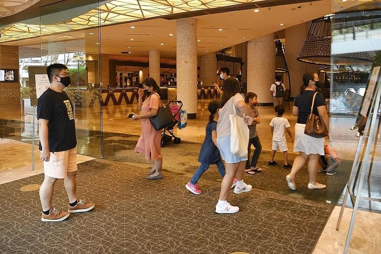 Guests at Pan Pacific Singapore yesterday. Hotels and travel websites reported a spike in the number of bookings for this week, as families head to hotels for staycations during the March school break. The flurry of hotel bookings came as Singaporean