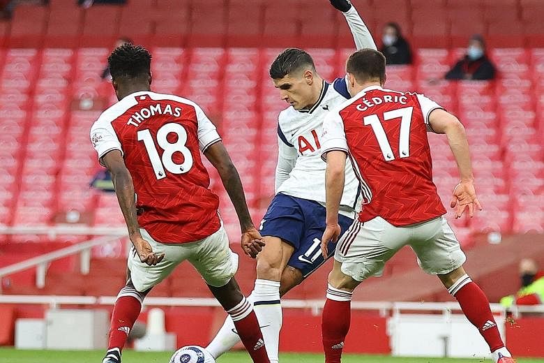Left: Spurs' Erik Lamela displaying great skill to score a "rabona" goal past Arsenal's Thomas Partey and Cedric Soares. But Spurs manager Jose Mourinho accused some of his players of "hiding" during the first half, and the Gunners recovered to win 2