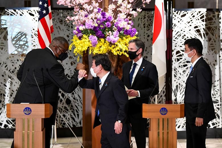 (From left) US Defence Secretary Lloyd Austin, Japan's Foreign Minister Toshimitsu Motegi, US Secretary of State Antony Blinken and Japan's Defence Minister Nobuo Kishi at a press conference after the "two-plus-two meeting" in Tokyo yesterday. The tw