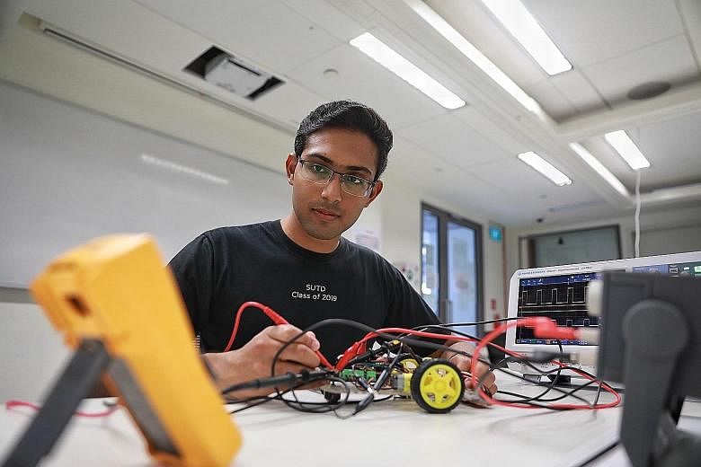 Mr Ashwin Venkatram (seen here with probes to examine the circuit board of a robot) is a hardware developer at electronics group Rohde & Schwarz. He builds electronic instruments that engineers can use in their laboratories to troubleshoot and design