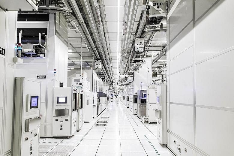 GlobalFoundries' cleanroom in Woodlands. While manufacturing still conjures up the image of dirty work environments for most, many producers now operate in cleanrooms and have highly automated facilities. An automated stocker system in Soitec's Singa