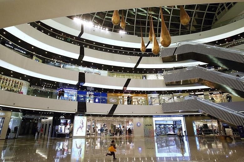Trouble for Mr Wang Jianlin - whose businesses range from entertainment to property (Tongzhou Wanda Plaza shopping mall in Beijing, right) - started in 2017 when banks halted funding for several of Dalian Wanda's global acquisitions. PHOTOS: 