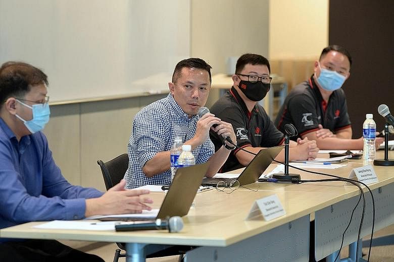 Singapore University of Social Sciences (SUSS) associate professor Leong Chan-Hoong speaking at a media conference yesterday on the results of the survey of 1,002 security officers, held at NTUC Centre. With him are (from left) SUSS research associat