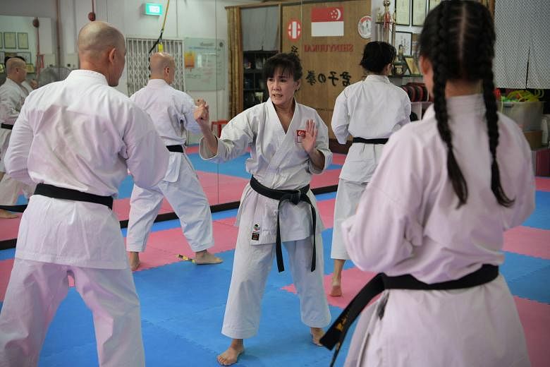 Ms Cindy Seah (left), 61, has close to 40 years of karate experience and is now a 6th Dan karate instructor.