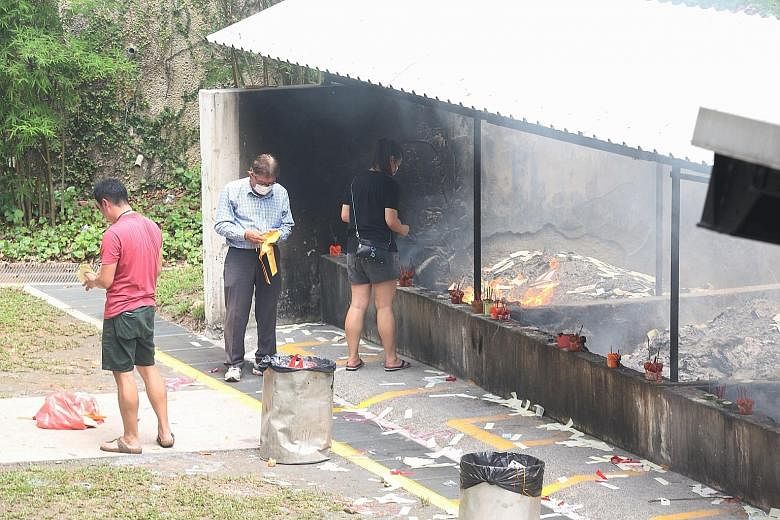 Visitors at the Mandai Columbarium yesterday, ahead of the Qing Ming Festival on Sunday. Those visiting Choa Chu Kang Cemetery and the government-managed columbaria in Choa Chu Kang, Mandai and Yishun are advised to limit the number of visitors to tw