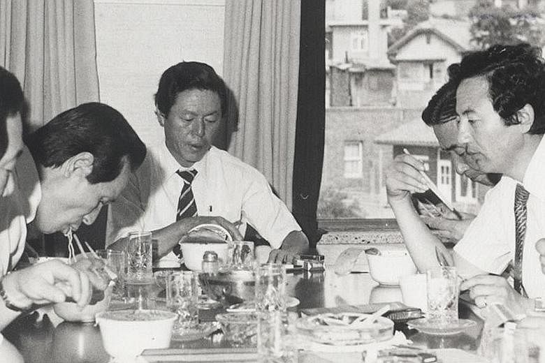 Nongshim founder Shin Choon-ho (centre) trying out noodles with his team in an undated photo. The spicy beef-base Shin Ramyun was launched in 1986. Mr Shin died of a chronic illness on March 27 at the age of 91.