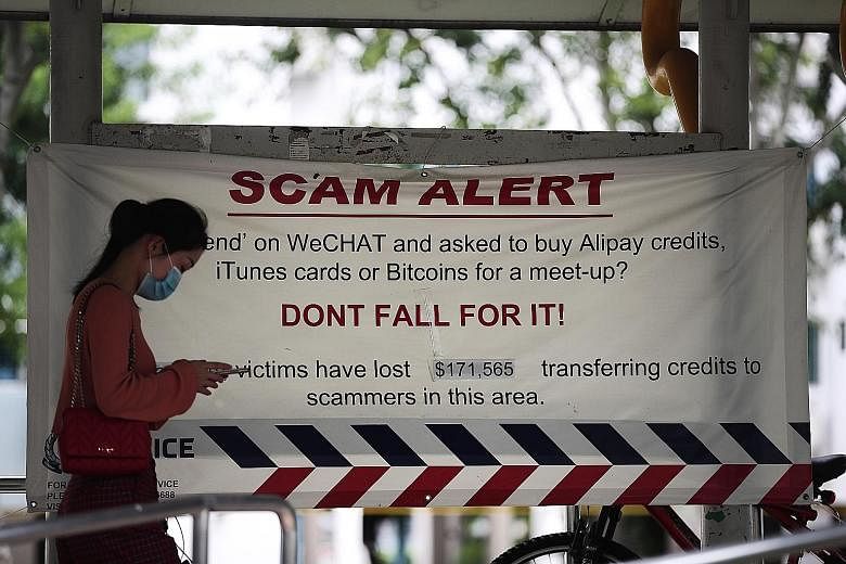 A scam alert banner in Clementi in June last year. E-commerce scams, social media impersonation scams, loan scams and banking-related phishing scams accounted for 68.1 per cent of the top 10 scams reported last year, said the police.