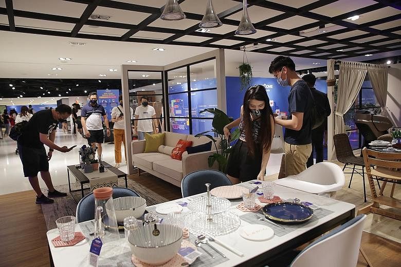 Shoppers checking out home furnishing items and other products at Lazada's pop-up store at Raffles City Shopping Centre last Saturday. The store, which will be open until April 18, features items from more than 100 brands, including Samsung, Philips 