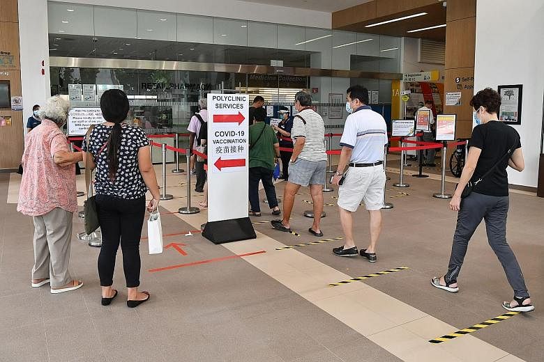 People entering Ang Mo Kio Polyclinic in January. Providing more health and social services goes beyond strengthening ministries or health departments, the writer says, adding that governments must change the way taxes are collected and distributed, 