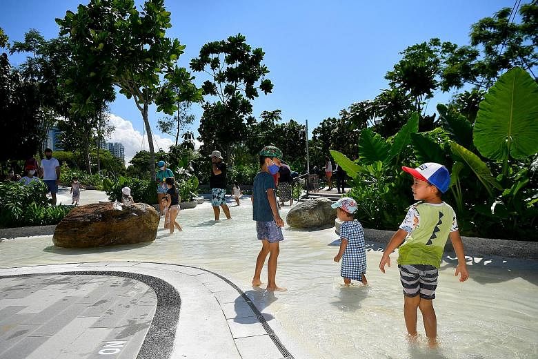 Visitors to Coastal PlayGrove at East Coast Park last month. Observers say that people here seem to be less keen on local tourism as the pandemic wears on, and that overseas travel has been sorely missed. ST PHOTO: LIM YAOHUI