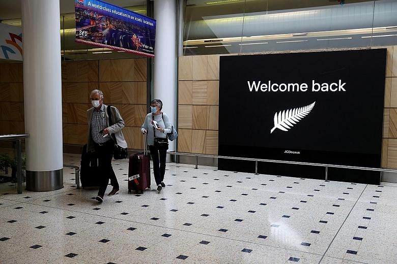 Passengers from New Zealand arriving at Sydney airport on Oct 16 last year. Australia has had a one-way travel bubble since October that allows people to enter from New Zealand without quarantining, though entry has been restricted several times foll