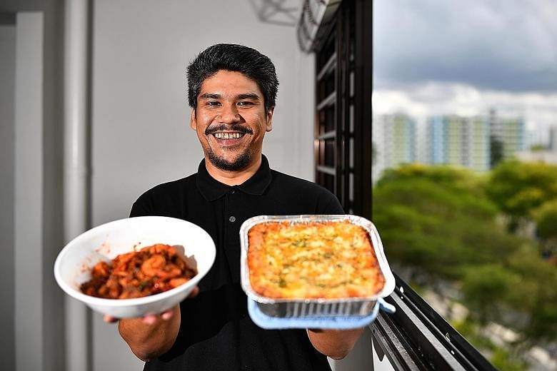 Mr Azlan Shah Rabel, founder of Foodprove, with his sambal goreng pengantin and lasagne - two of the dishes on the menu of his catering business.