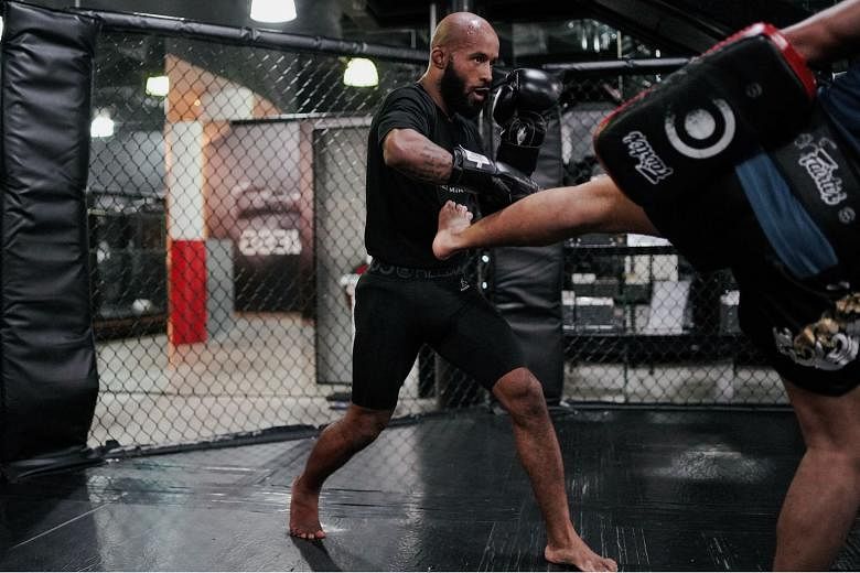 Former UFC flyweight champion Demetrious Johnson training in 2019. He and Eddie Alvarez are the headline acts in today's event. ST FILE PHOTO