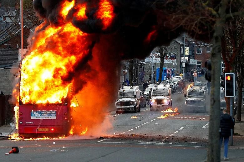 A bus set alight by protesters in Belfast, Northern Ireland, on Wednesday, extending a week of rioting that commentators have linked to fury among the pro-United Kingdom community at economic disruption caused by Britain's Brexit departure from the E
