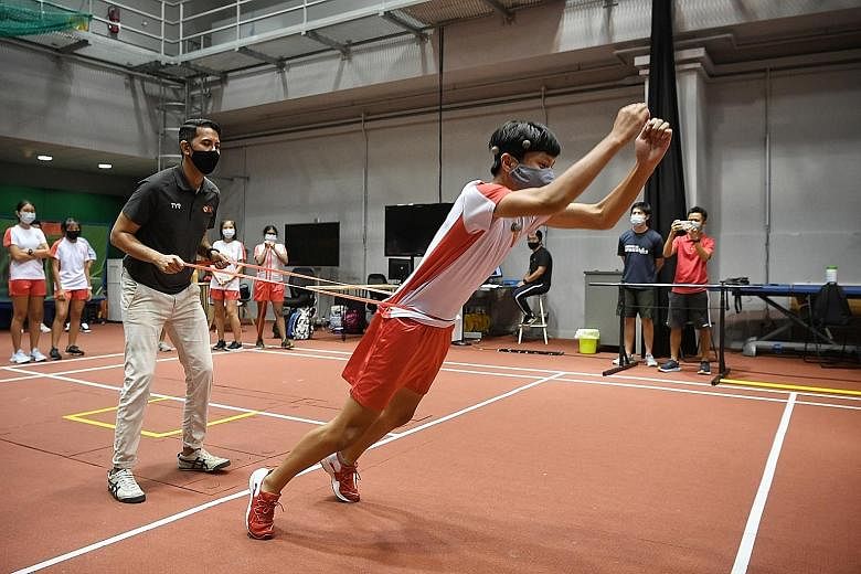 Dr Muhammad Luqman Abdul Aziz, an SSI sport biomechanist, working with an NJC student on an exercise that helps improve standing broad jump performance. ST PHOTO: KUA CHEE SIONG