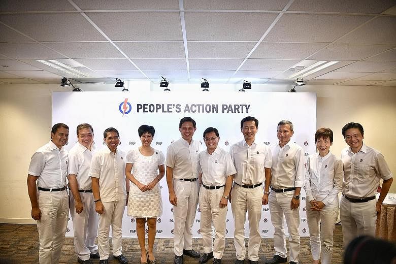 (From left) MPs Christopher de Souza and Sitoh Yih Pin, Ministers in the Prime Minister's Office Maliki Osman and Indranee Rajah, Trade and Industry Minister Chan Chun Sing, Deputy Prime Minister Heng Swee Keat, Transport Minister Ong Ye Kung, Foreig