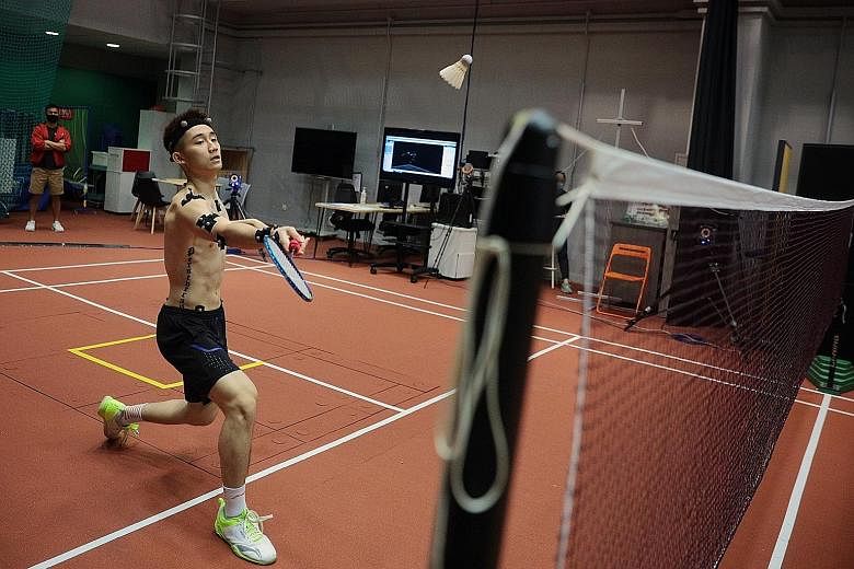 Left: Shuttler Jason Teh taking part in testing synthetic badminton shuttles at the biomechanics lab at the Singapore Sports Institute. Above: Getting Teh ready for the testing.