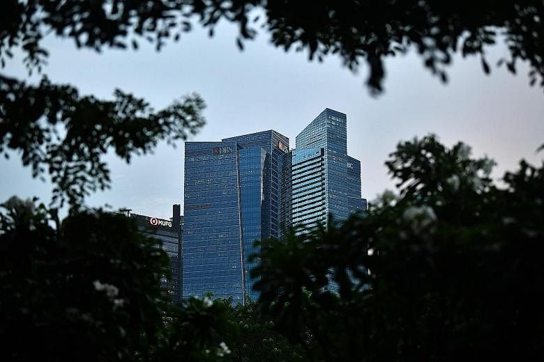 DBS is apparently set to surrender about 21/2 floors in Tower 3 of Marina Bay Financial Centre in December. Banks around the world are rethinking their use of offices after the pandemic popularised remote working. ST PHOTO: LIM YAOHUI