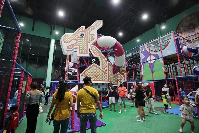 Left: The HomeTeamNS Khatib clubhouse is home to Adventure HQ, an indoor hub complete with rock climbing walls, sensory adventure trails and rope courses. Above: T-Play Khatib, a Peranakan-themed indoor playground, is also housed in the new five-stor