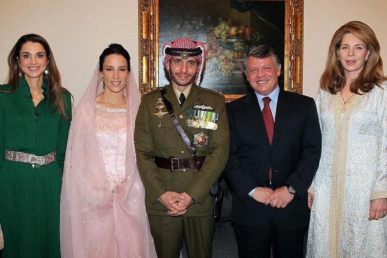 A 2012 photo of Jordan's Prince Hamzah (centre) and his wife, Princess Basma Otoum, beside him at their wedding ceremony in Amman. With them are King Abdullah II and Queen Rania (in green), as well as Queen Noor, widow of the late King Hussein. While
